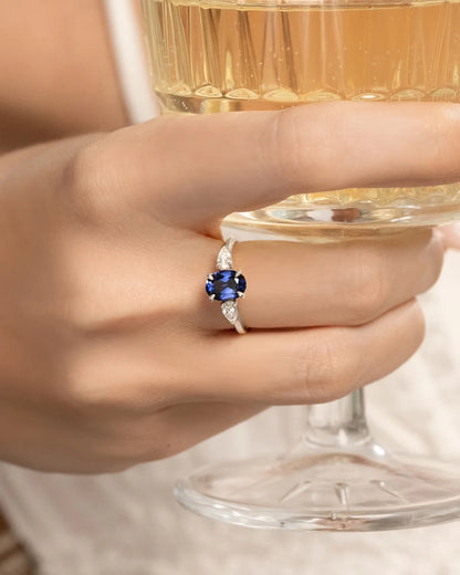 Blue Sapphire Oval Cut Three Stone Engagement Ring in Sterling Silver - SJR London Timepiece