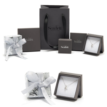 A silver 21st birthday charm with intricate detailing, displayed on a white background by Scarlett Jewellery.