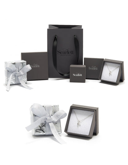 A silver mini lifetime charm bracelet with heart and star charms, displayed on a white background by Scarlett Jewellery.