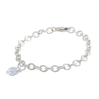 Silver charm bracelet featuring a monstera palm design by Scarlett Jewellery.