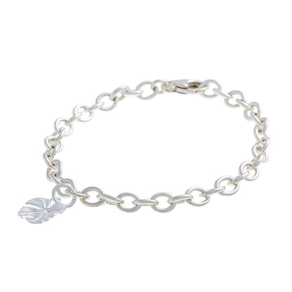 Silver charm bracelet featuring a monstera palm design by Scarlett Jewellery.