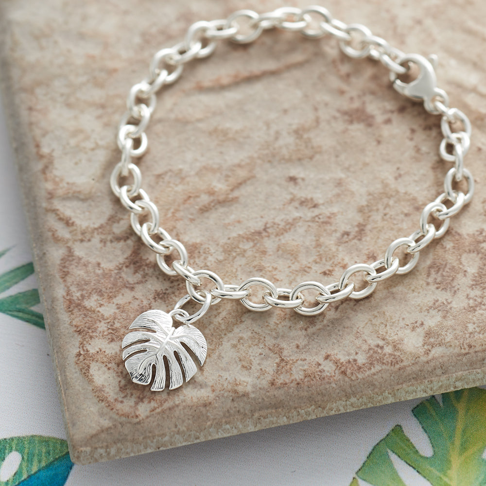 Silver charm bracelet featuring a monstera palm design by Scarlett Jewellery.