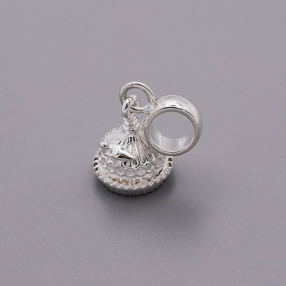 Silver charm shaped like the Brighton Pavilion, detailed and polished, displayed on a white background by Scarlett Jewellery.