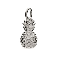 A silver pineapple charm shaped like a tropical fruit, detailed with texture and shine, by Scarlett Jewellery.