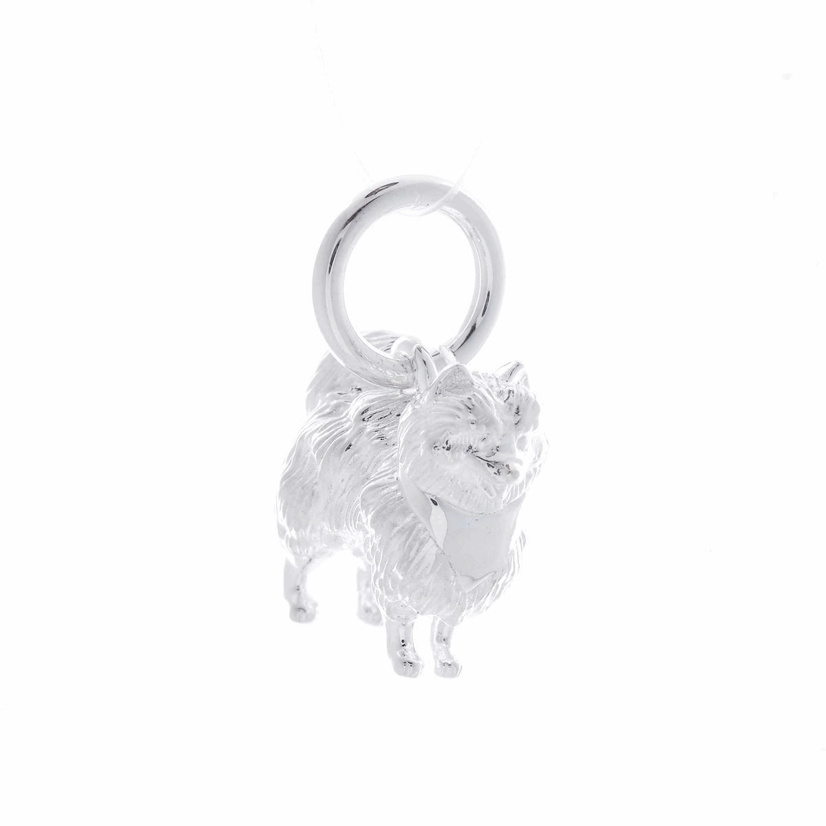 A silver Pomeranian dog charm shaped like a tiny puppy, detailed with realistic features, by Scarlett Jewellery.