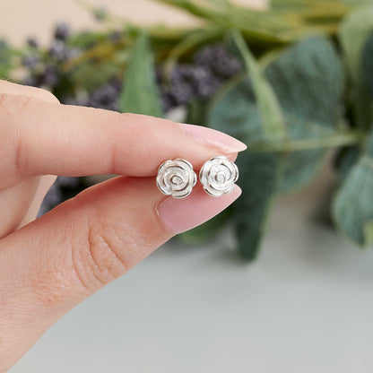 Silver stud earrings featuring a delicate rose flower design by Scarlett Jewellery.