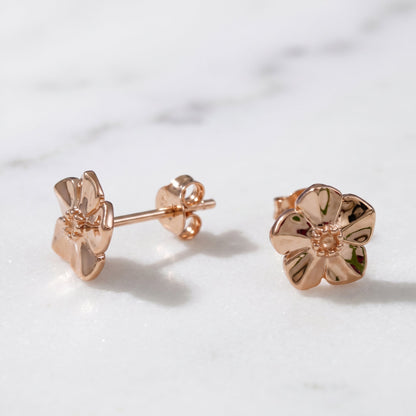 Small rose gold vermeil silver stud earrings with a delicate forget-me-not design by Scarlett Jewellery.
