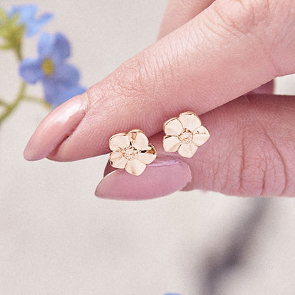 Small rose gold vermeil silver stud earrings with a delicate forget-me-not design by Scarlett Jewellery.