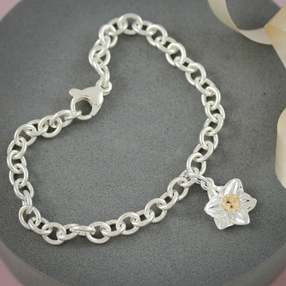 A daffodil flower charm in silver and solid gold by Scarlett Jewellery