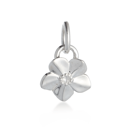 A silver forget-me-not flower charm with delicate petals, personalized engraving, and a polished finish by Scarlett Jewellery