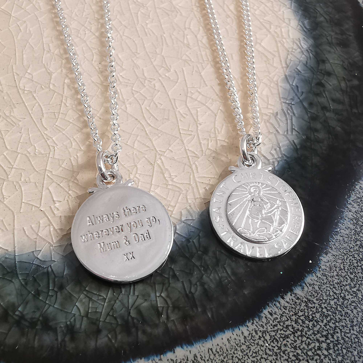 Silver St Christopher pendant on a chain with personalized engraving, worn around the neck by Scarlett Jewellery.