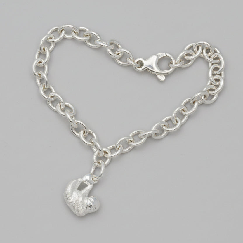 Sloth silver charm with detailed texture, small and delicate, by Scarlett Jewellery.