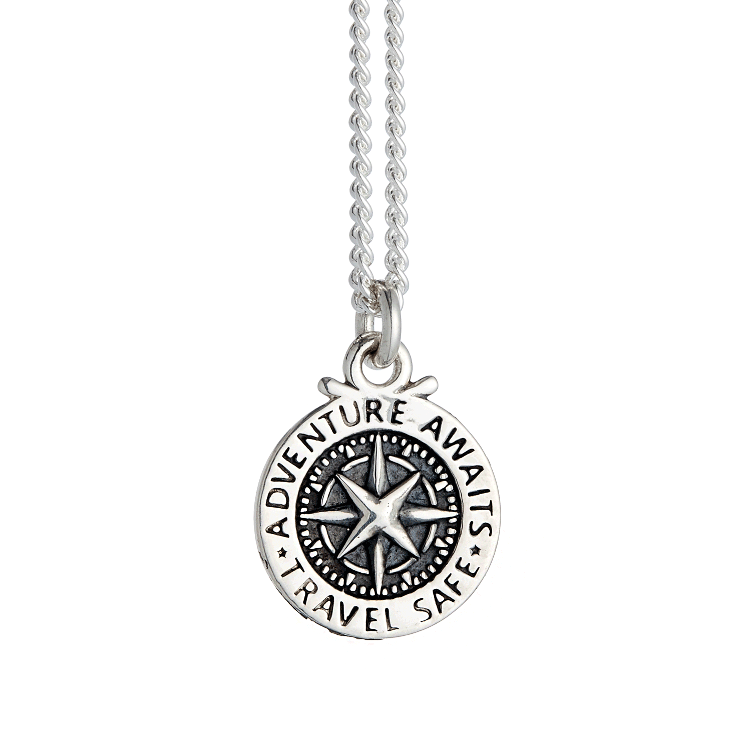 A silver compass charm with engraved details, displayed on a soft background, part of the Travel Safe collection by Scarlett 