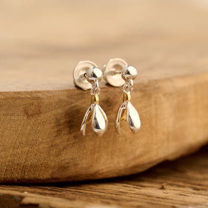 Silver and gold vermeil drop earrings with a delicate snowdrop design by Scarlett Jewellery