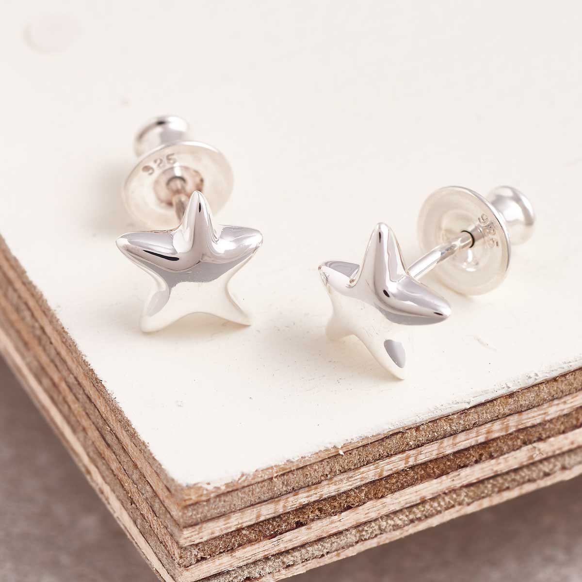 Silver stud earrings with a starry finish, featuring tiny sparkling details, by Scarlett Jewellery.