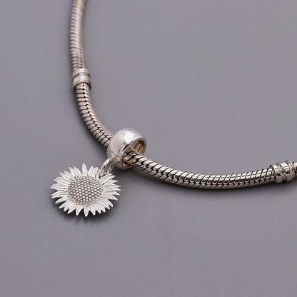 Sunflower silver charm with detailed petal texture by Scarlett Jewellery.
