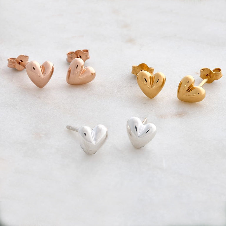 Sweetheart silver stud earrings with delicate heart design by Scarlett Jewellery.