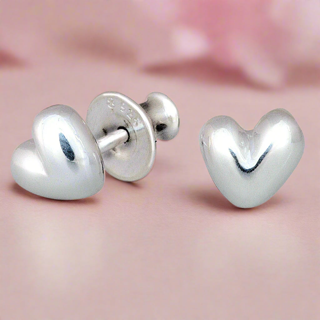 Sweetheart silver stud earrings with delicate heart design by Scarlett Jewellery.