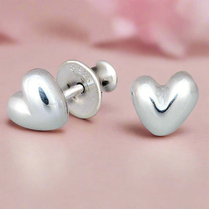 Sweetheart silver stud earrings with delicate heart design by Scarlett Jewellery.
