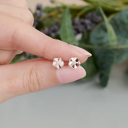 Tiny rose gold vermeil stud earrings with a delicate forget-me-not design by Scarlett Jewellery
