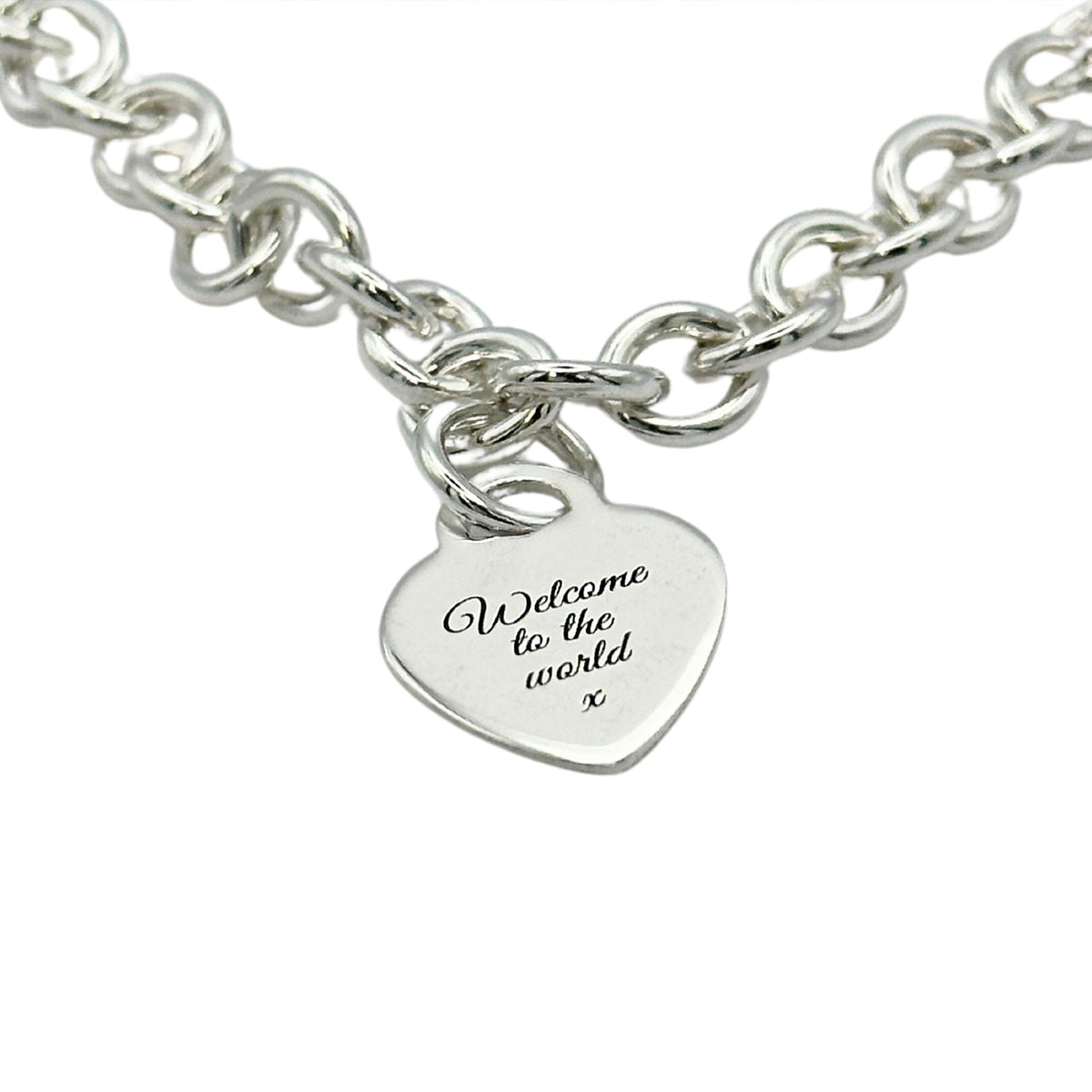 A silver heart tag charm bracelet with personalized engraving by Scarlett Jewellery