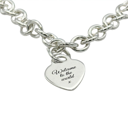 A silver heart tag charm bracelet with personalized engraving by Scarlett Jewellery