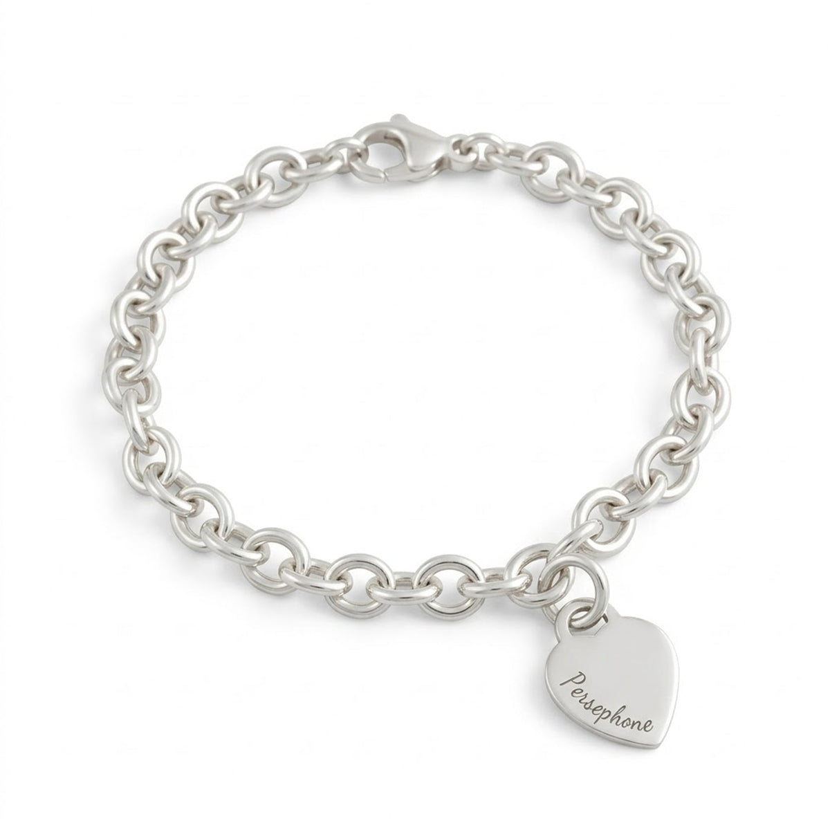A silver heart tag charm bracelet with personalized engraving by Scarlett Jewellery