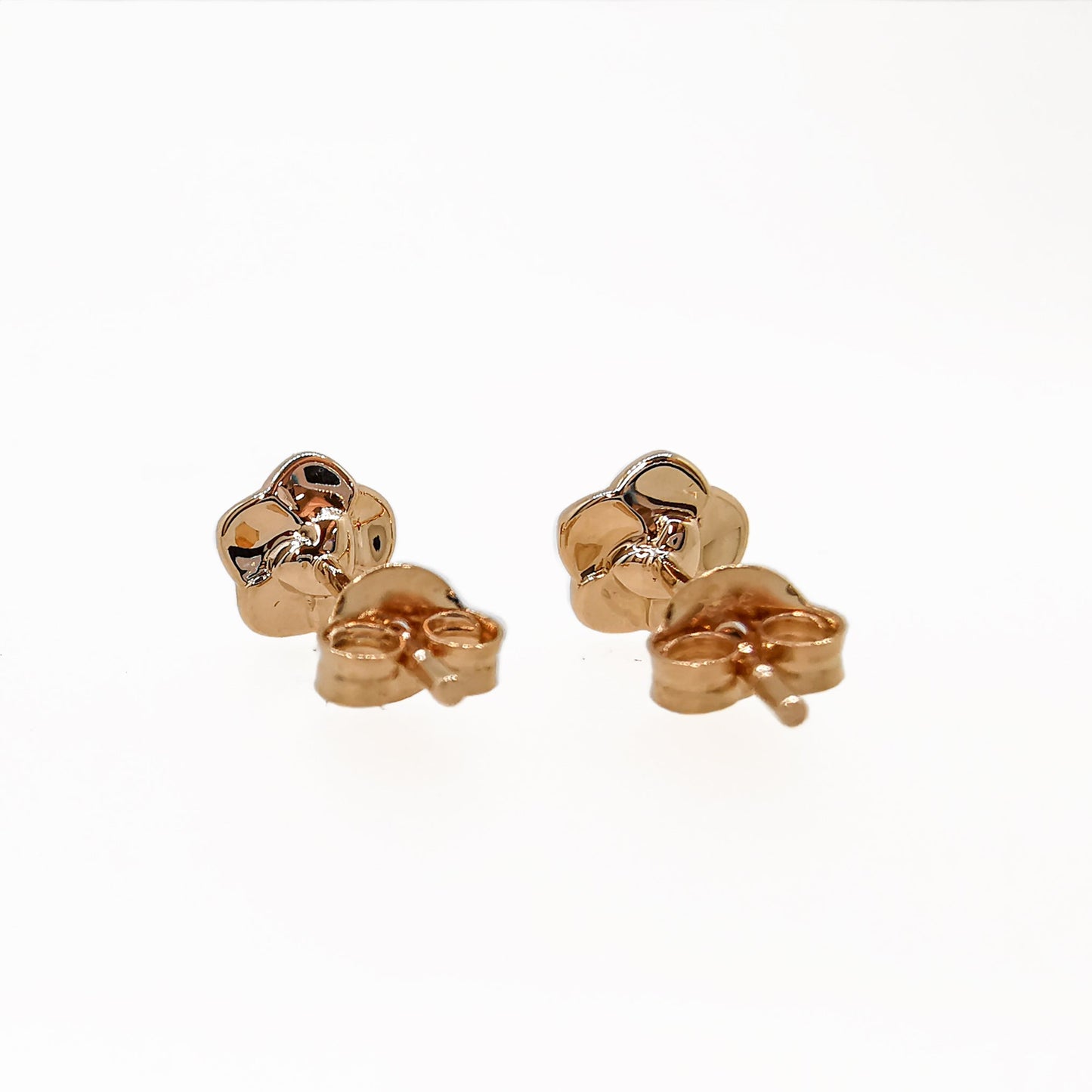 Tiny rose gold vermeil stud earrings with a forget-me-not design by Scarlett Jewellery