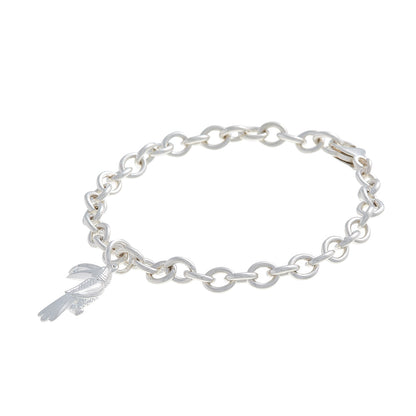 A silver toucan parrot charm with detailed feather texture, displayed on a white background by Scarlett Jewellery.