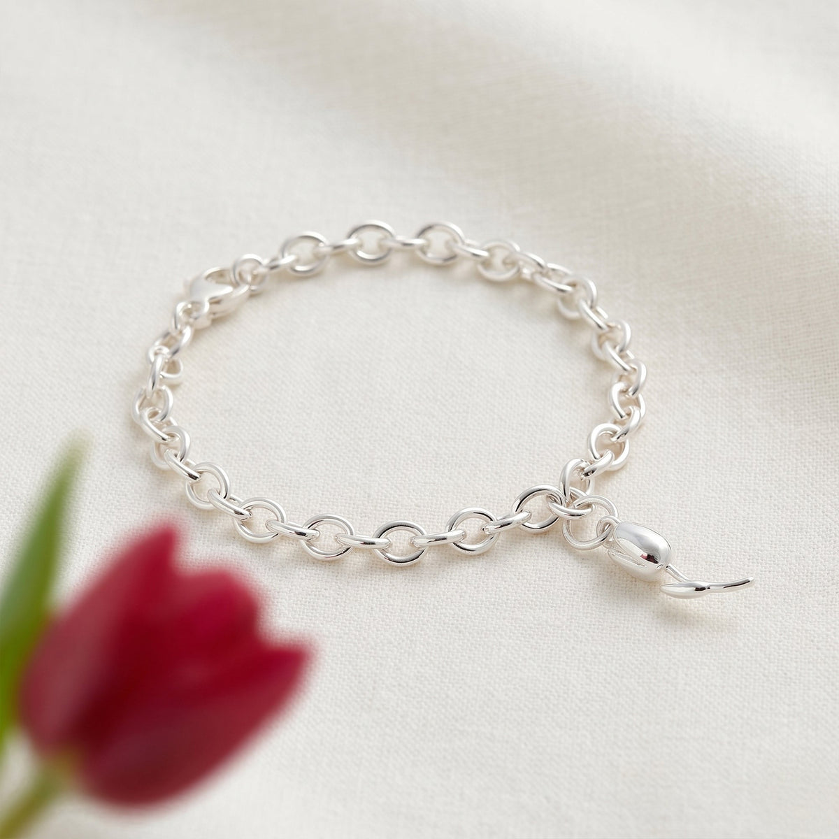 Silver tulip flower charm with detailed petal texture, part of the Charms collection by Scarlett Jewellery.