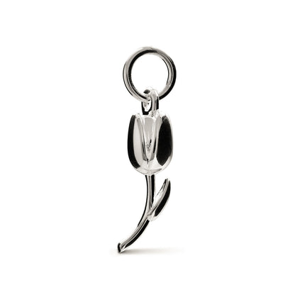 A silver tulip flower charm with intricate detailing, displayed on a soft background, by Scarlett Jewellery.