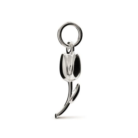 A silver tulip flower charm with intricate detailing, displayed on a soft background, by Scarlett Jewellery.
