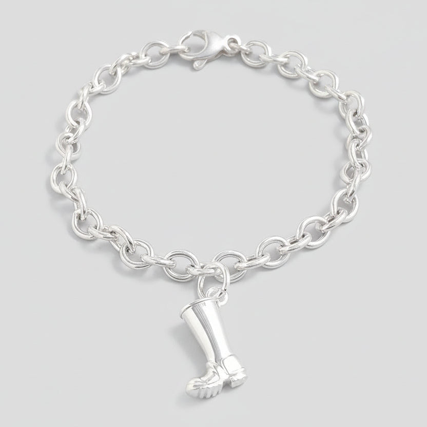 Silver charm with personalized engraving on a welly boot by Scarlett Jewellery.