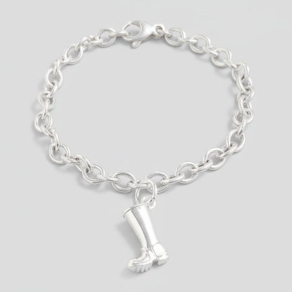 Silver charm with personalized engraving on a welly boot by Scarlett Jewellery.