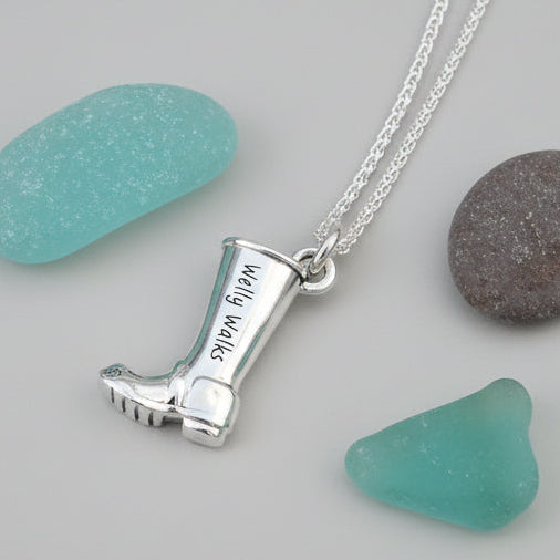 Silver charm with personalized engraving on a welly boot by Scarlett Jewellery.