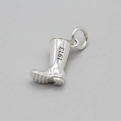 Silver charm with personalized engraving on a welly boot by Scarlett Jewellery.