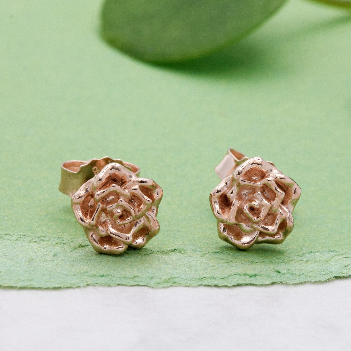Wild rose gold vermeil silver stud earrings with delicate floral detailing by Scarlett Jewellery.